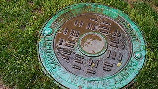 [photo, Howard County Sanitary Sewer manhole cover, Main St. and Ellicott Mills Drive, Ellicott City, Maryland]